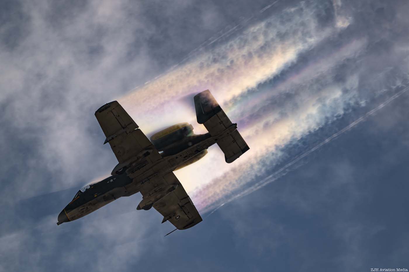 A-10 Thunderbolt II underside in a partly cloudy sky