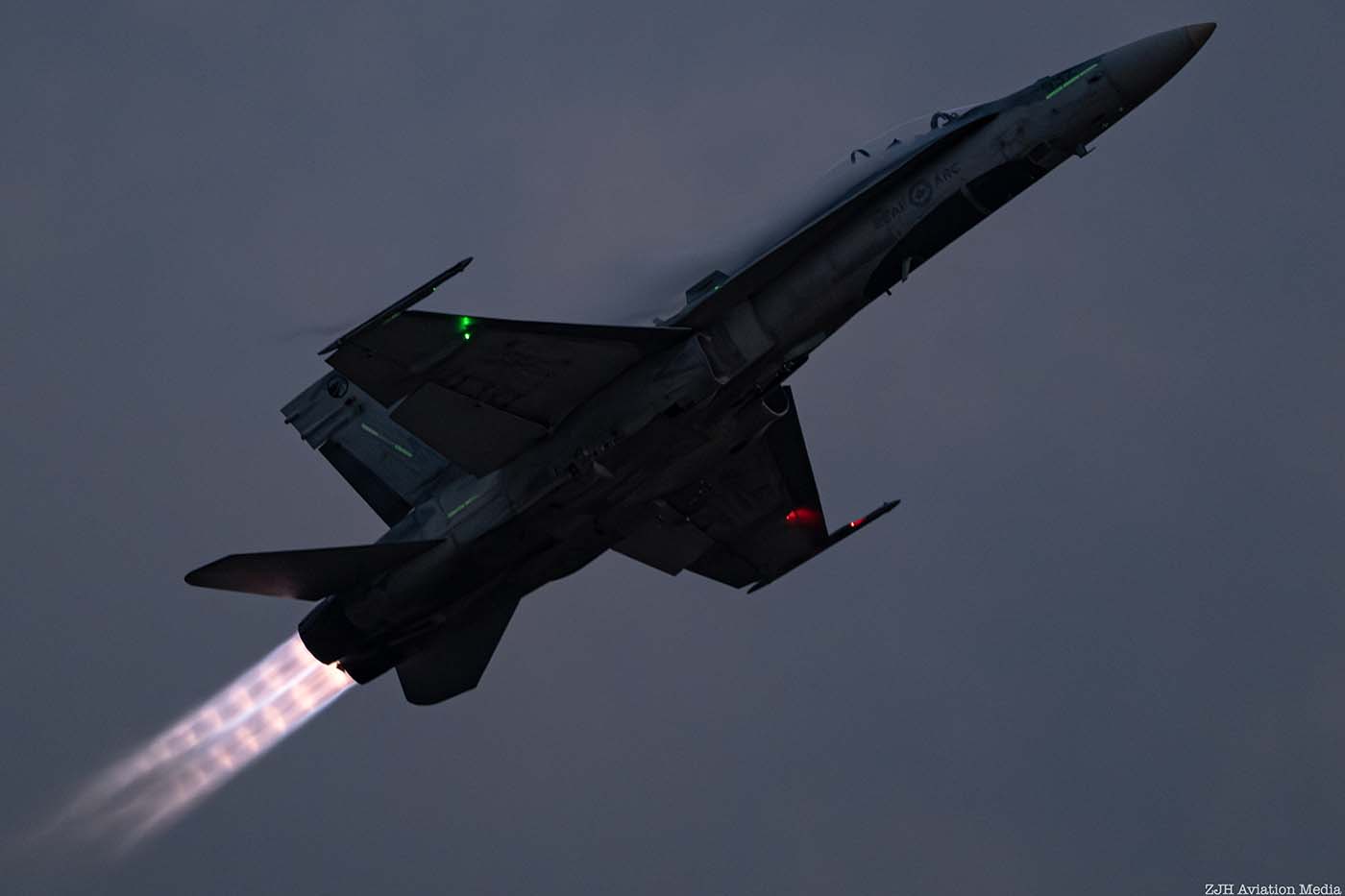 CF-188 Hornet side view in a twilight blue sky