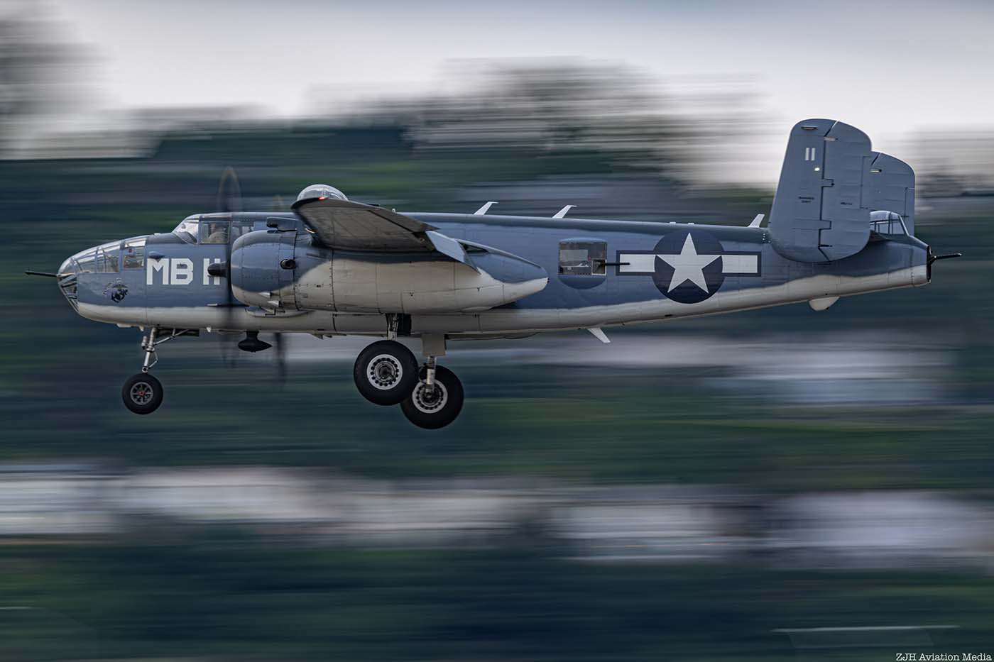 PBJ Mitchell side view with a mountain background